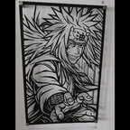 Corte láser y pieza terminada del cuadro de Jiraya en acero, colgado en pared